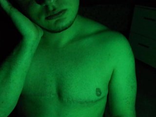 Smoking a cigarette under a green light