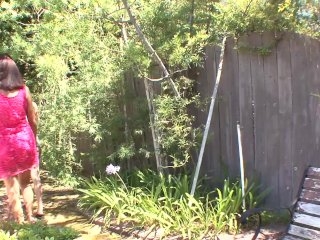 Two girlfriends are relaxing in the garden