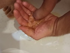 Pissing on my palm and masturbating my dick in the bathroom.