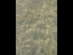 Feet under water at sea in sunny day