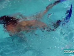 Hot brunette slut Candy swims underwater
