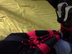 Laura XXX is wearing panthyhose and high heels. She's hogtied