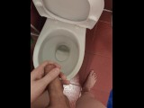 The guy pisses in the toilet for a long time