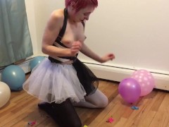 Clown girl pops balloons