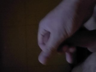 Stroking thick cock and cum at the adult theater