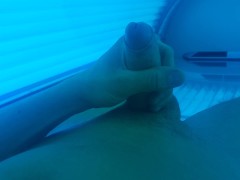 Boy masturbating in solarium