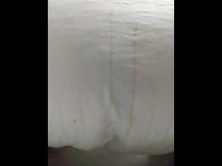 Face down ass up filling a giant diaper with piss then squeezing it out