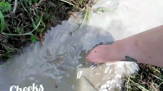 Bare feet in mud