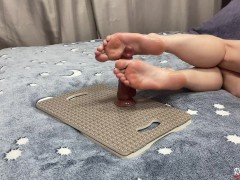 A student decided to play with a dildo after classes. Footjob with a dildo. Perfect feet. Footfetish