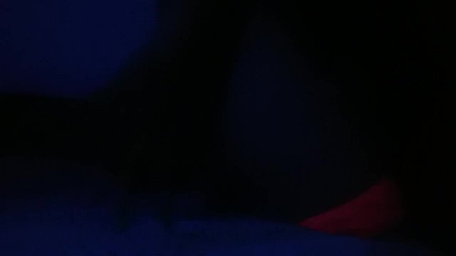 Crossdresser streaptease under UV light