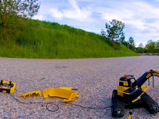 Big excavator is destroyed kicked, trampled, crushed, smashed, crushed,broken plastic_car, crush