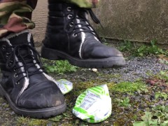 Elf stamps on cans with her dirty boots.