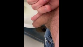 Small uncut cock pissing in public bathroom