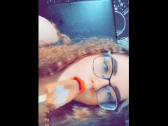 Thick brunette sucking on a popsicle