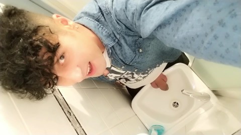 Peeing to the sink with uncut cock