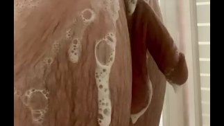 White college guy showering