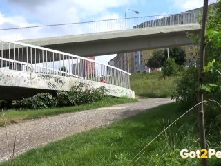 Stunning Brunette Pisses Through Railing