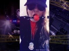 Trying on my police accessories. Even drinking the coffee to go with it.