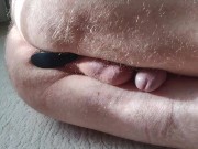 Anal play with silicone butt plug.
