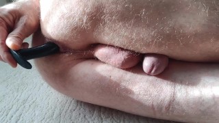 Anal play with silicone butt plug.