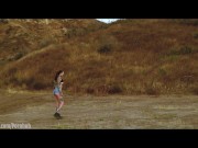 Submissive masochist Rocky Emerson tied atop a mountain and caned in the open air