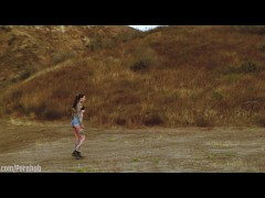 Submissive masochist Rocky Emerson tied atop a mountain and caned in the open air