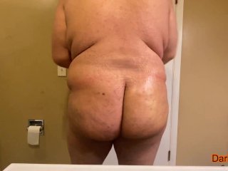 Fat man oiling up his fat ass then shaking it