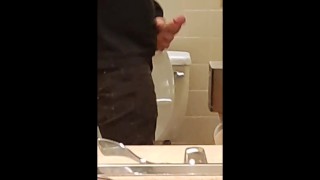 Horny guy jerks off and cums in public bathroom