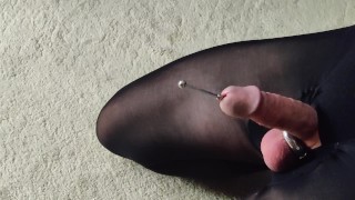 Extreme urethral sounding, close up.