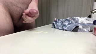 He cums on counter, licks up some of his own cum