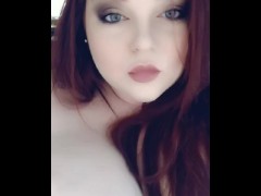Redhead teases her pierced tits