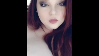 Redhead teases her pierced tits