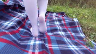 Schoolgirl In Uniform Displays Her Legs Feet And Panties Under Her Skirt While Wearing White Knee Socks