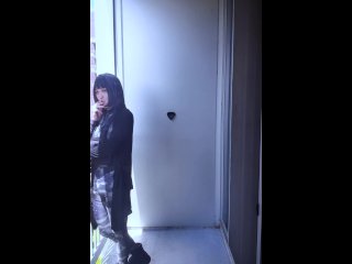 Hari smokes on her balcony