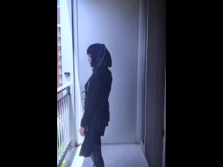 Hari smokes on her balcony