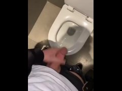 Showing off my hard cock in a public toilet