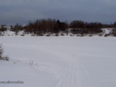 Russian guy walks in the snow near the river, pissing in the snow, he was noticed by a strange guy