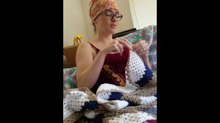Creature crocheting and singing a tune