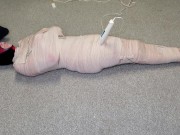 Preview 2 of Harley Quinn wrapped in layers of mummification bondage then teased with a wand & made to cum