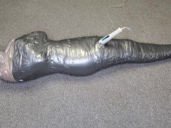 Harley Quinn wrapped in layers of mummification bondage then teased with a wand & made to cum