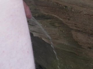 Skinny Guy pissing at a public nude beach