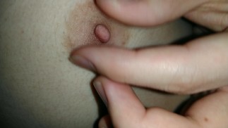 Frustrated Japanese male college student moans as he torments his sensitive nipples