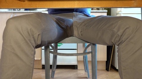 Pissing in jeans under the table