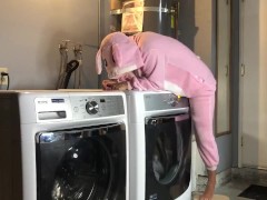 Bunny onesie humps dryer while doing laundry