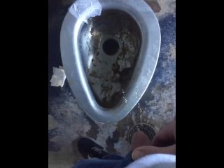 Taking a leak in a nasty outdoor public bathroom