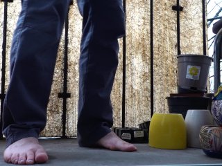 Desperate pee in jeans on the balcony