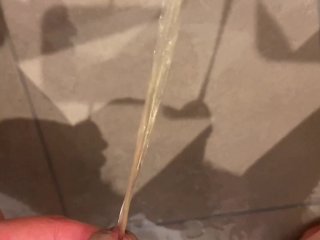 Massive urination of a muscular man