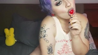Sucking a lollipop