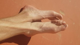 Zonnebadende voeten show