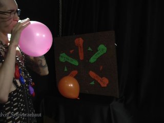 Nicky as a superhero destroys balloons